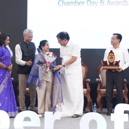 Geetha Saleesh receiving the Best Woman Entrepreneur Award from the Thrissur Chamber of Commerce.